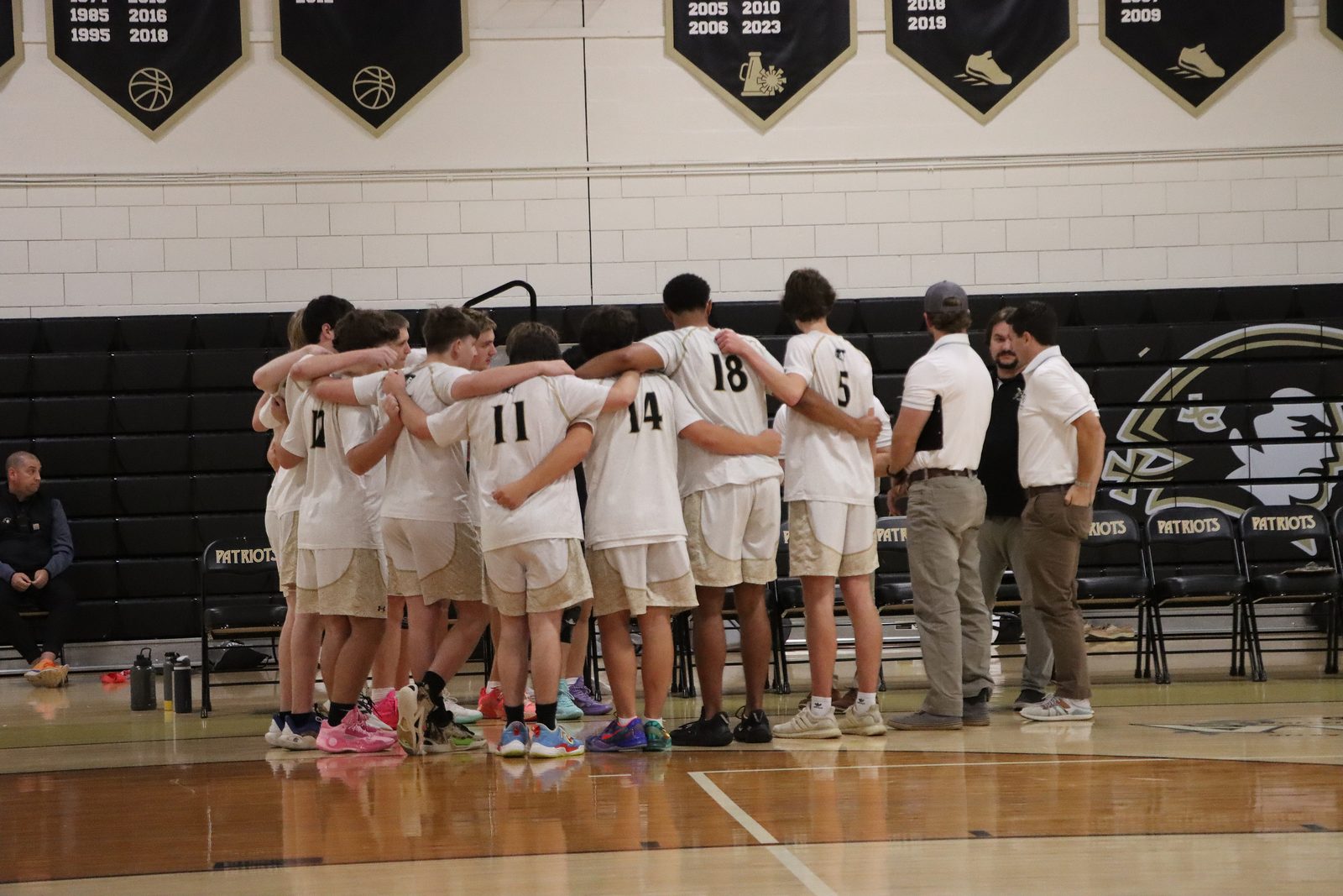 John Carroll Patriots volleyball team huddle